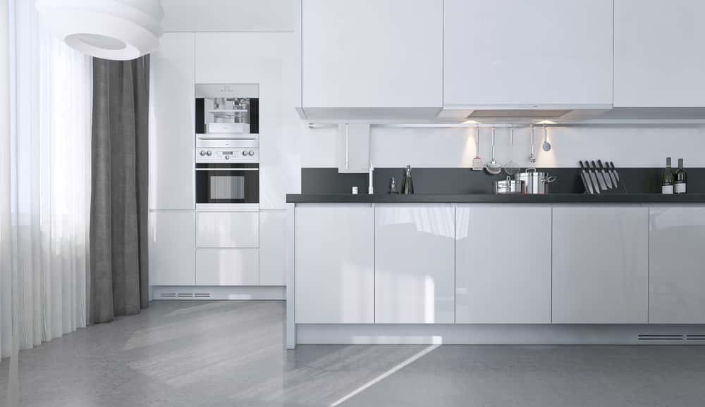 Minimalist white kitchen designs with sleek cabinets and built-in modern appliances