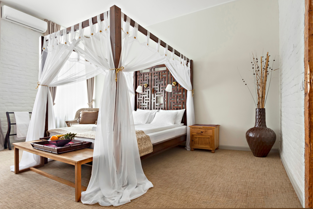 canopy bed with White curtains