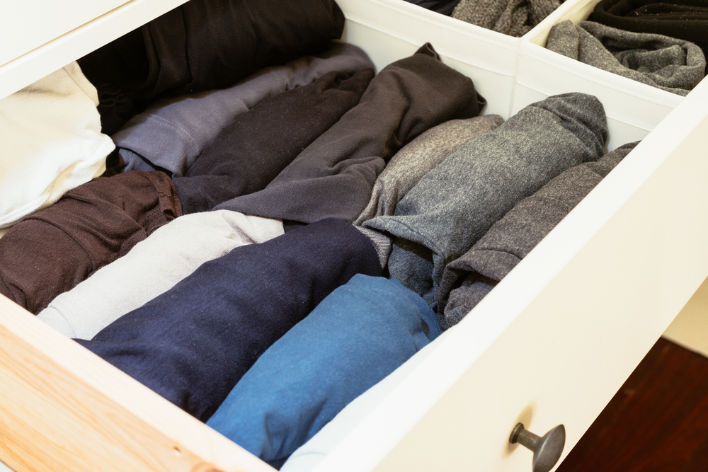 organizing undergarments in drawers