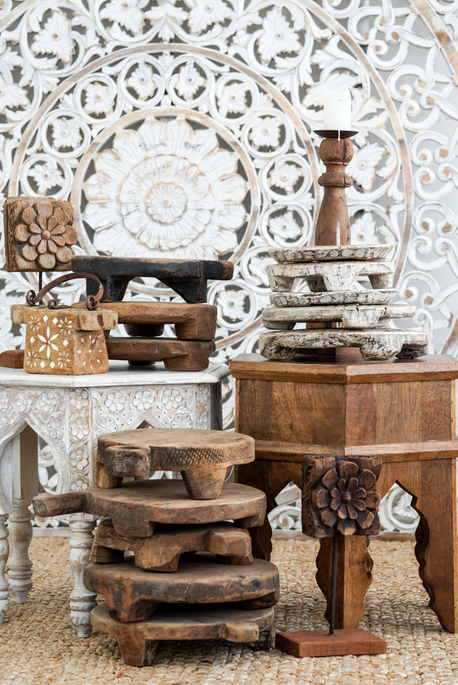 Rustic antique Bengali home decor with wooden furniture and carved accents