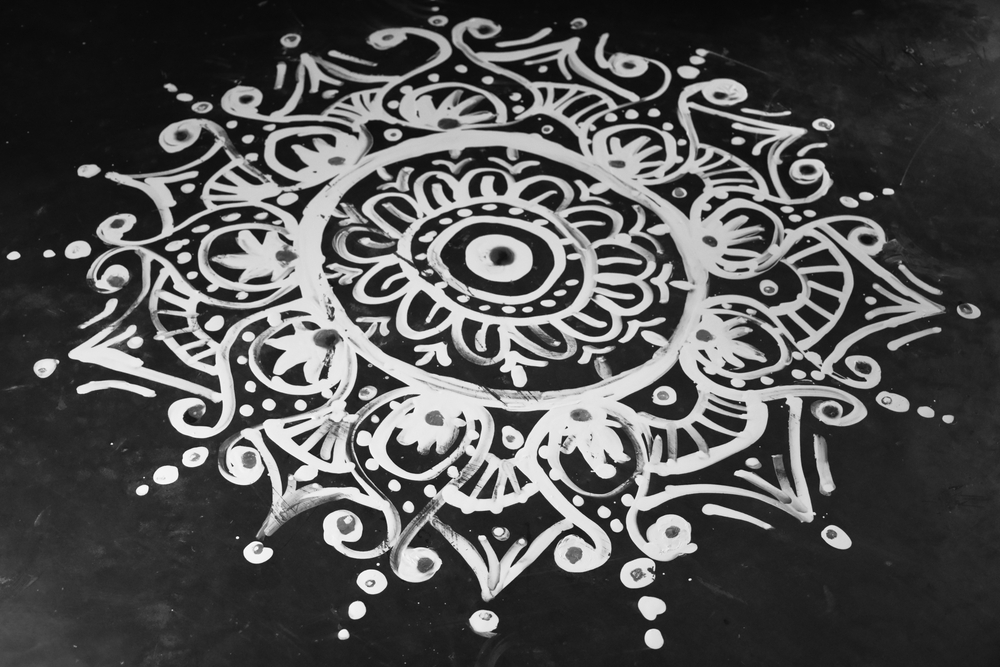 Traditional Bengali home decor with Alpona floor design in white paint