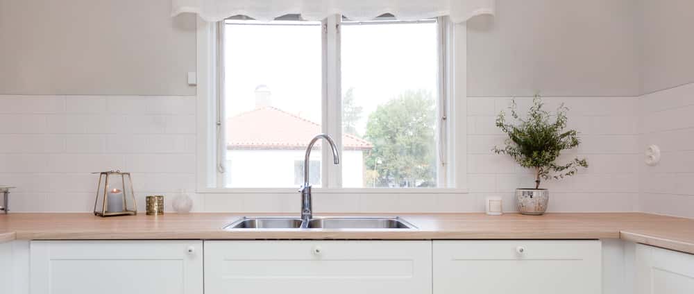 Elegant kitchen vastu tips sink layout with soft daylight and greenery