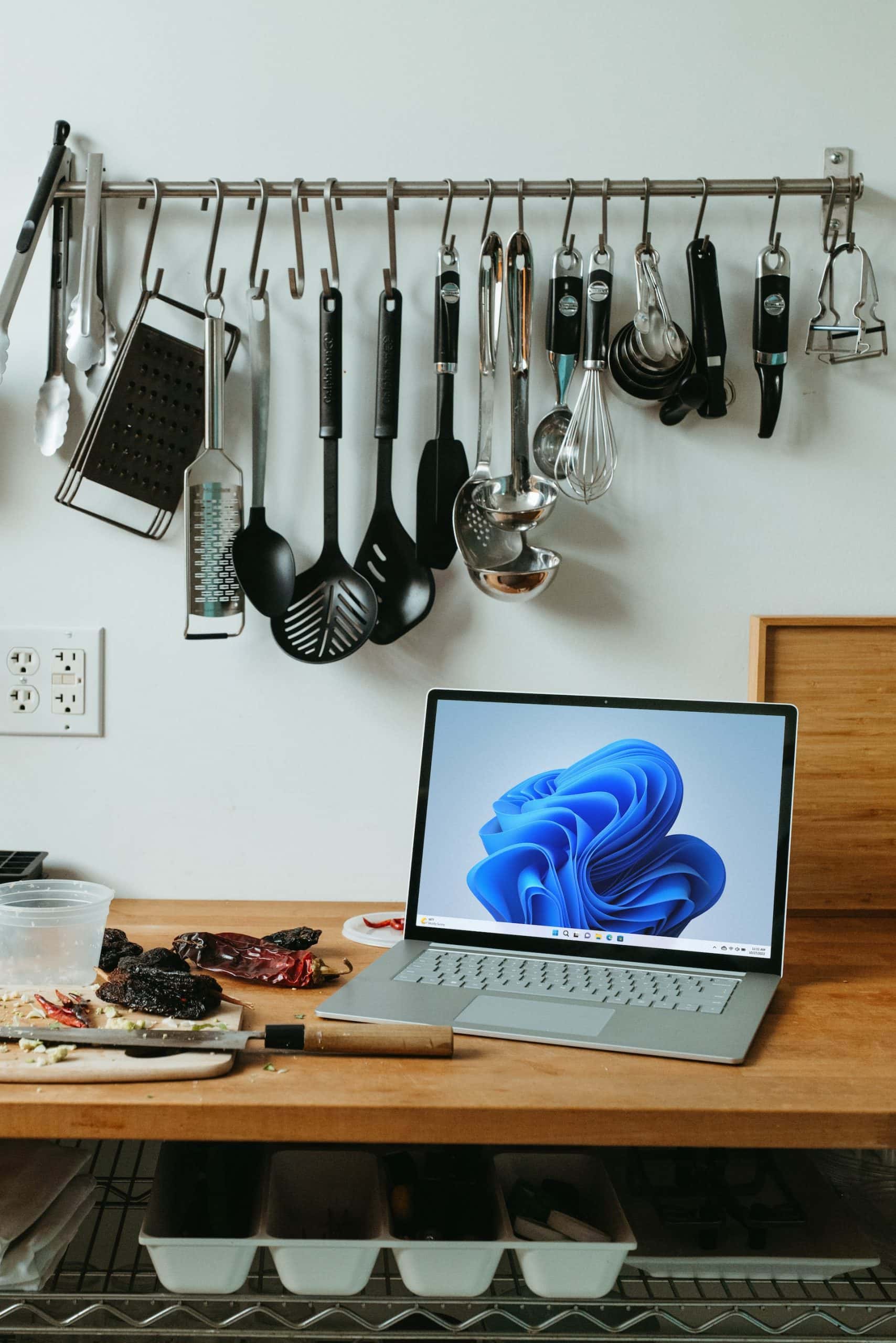 Stylish straight kitchen design with tools, wood counter, and modern workspace setup.