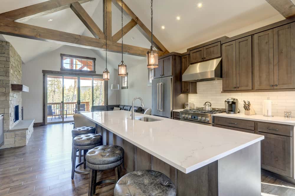 Elegant corian countertops material on island in rustic modern open kitchen