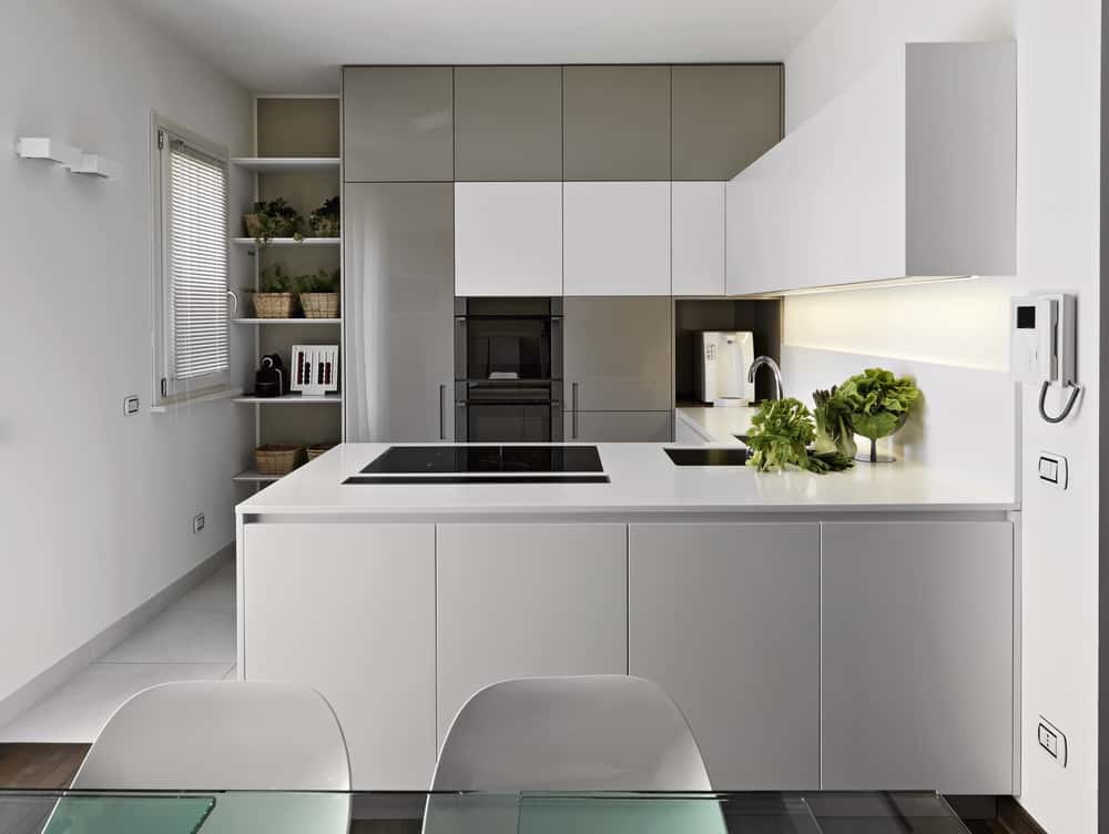 Bright minimalist kitchen designs with built-in appliances and handleless white cabinetry