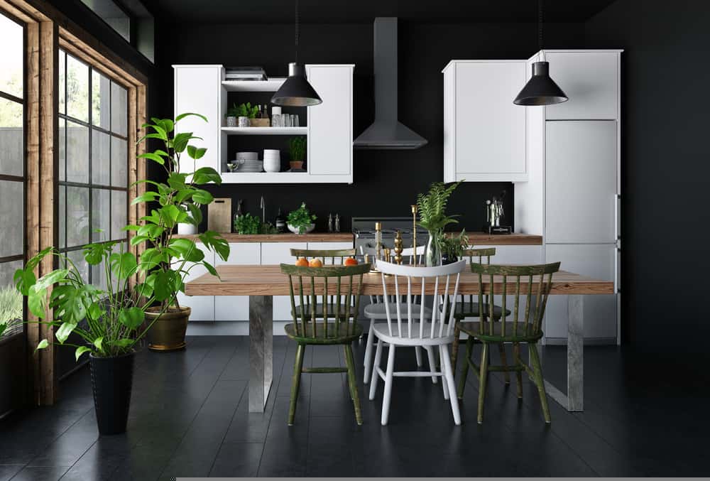Simple minimalist kitchen designs with black walls, wood dining table, and indoor plants