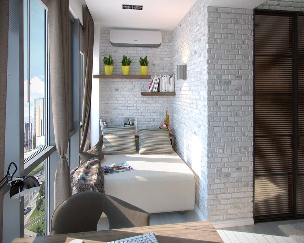 Bright open balcony into a room with reading nook and book shelf