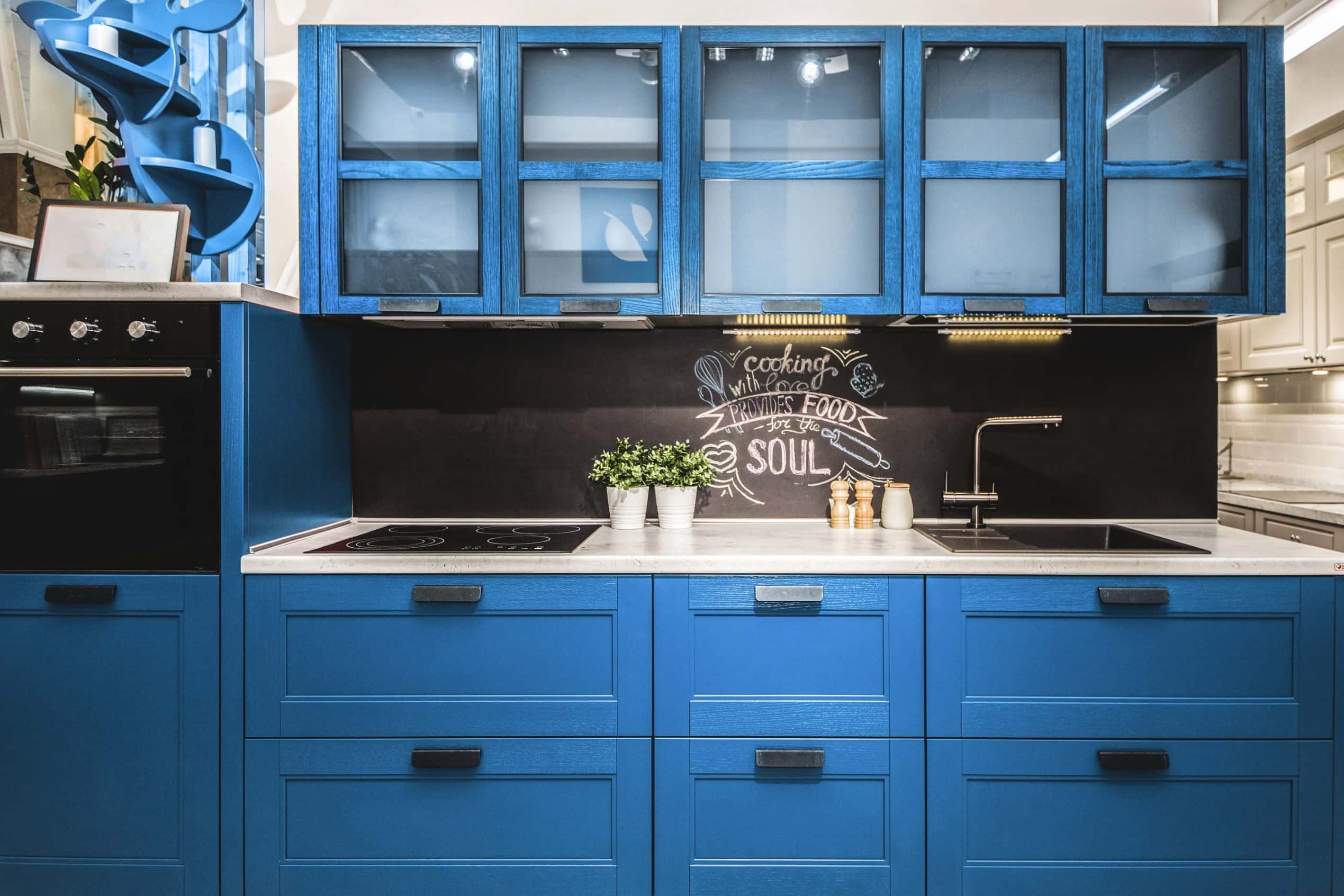 Vintage-style modular kitchen colour combination in black and distressed blue