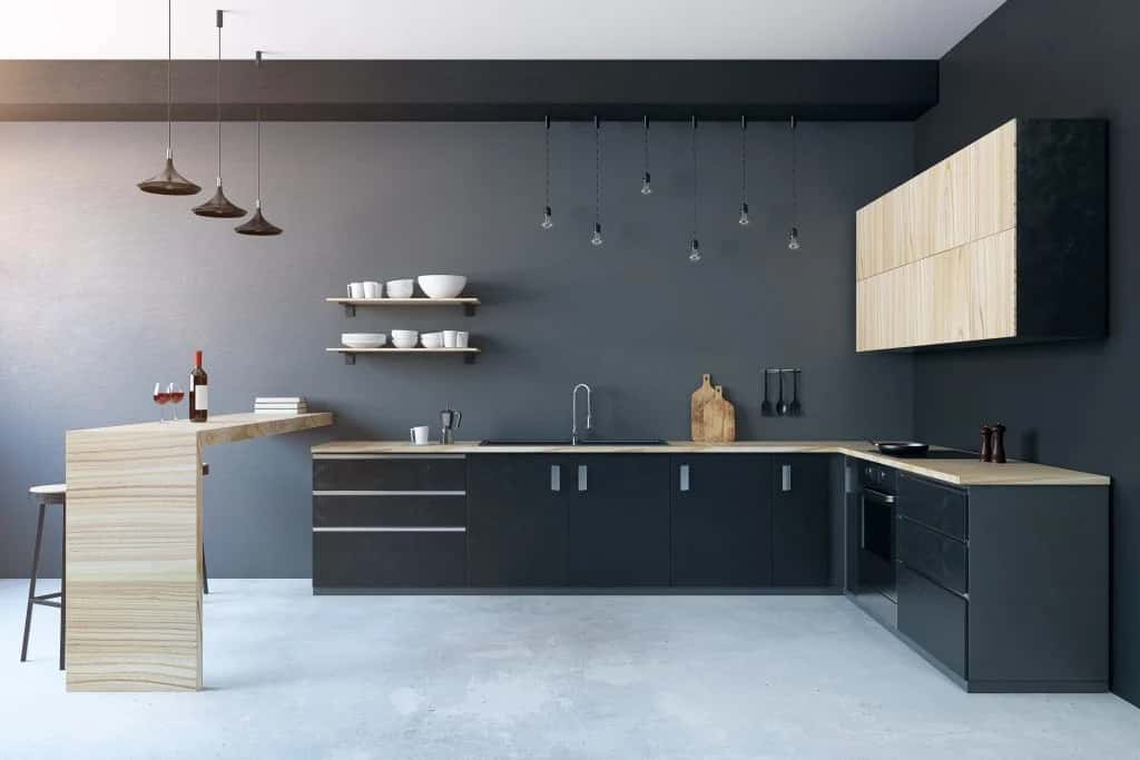 Modular kitchen design colour combination in black and wood for an earthy-modern look