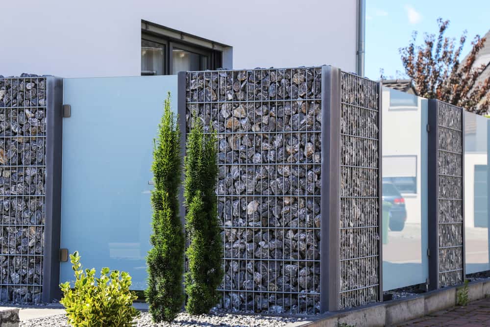 Sleek Latest Boundary Wall Design with glass and stone elements