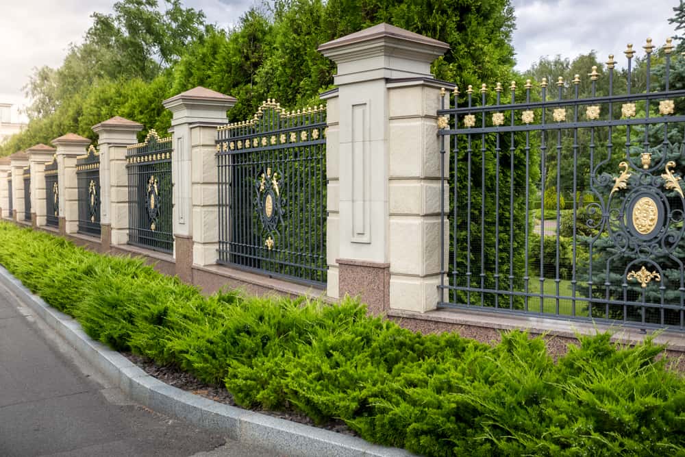 Elegant Modern Boundary Wall Design with metal and stone columns