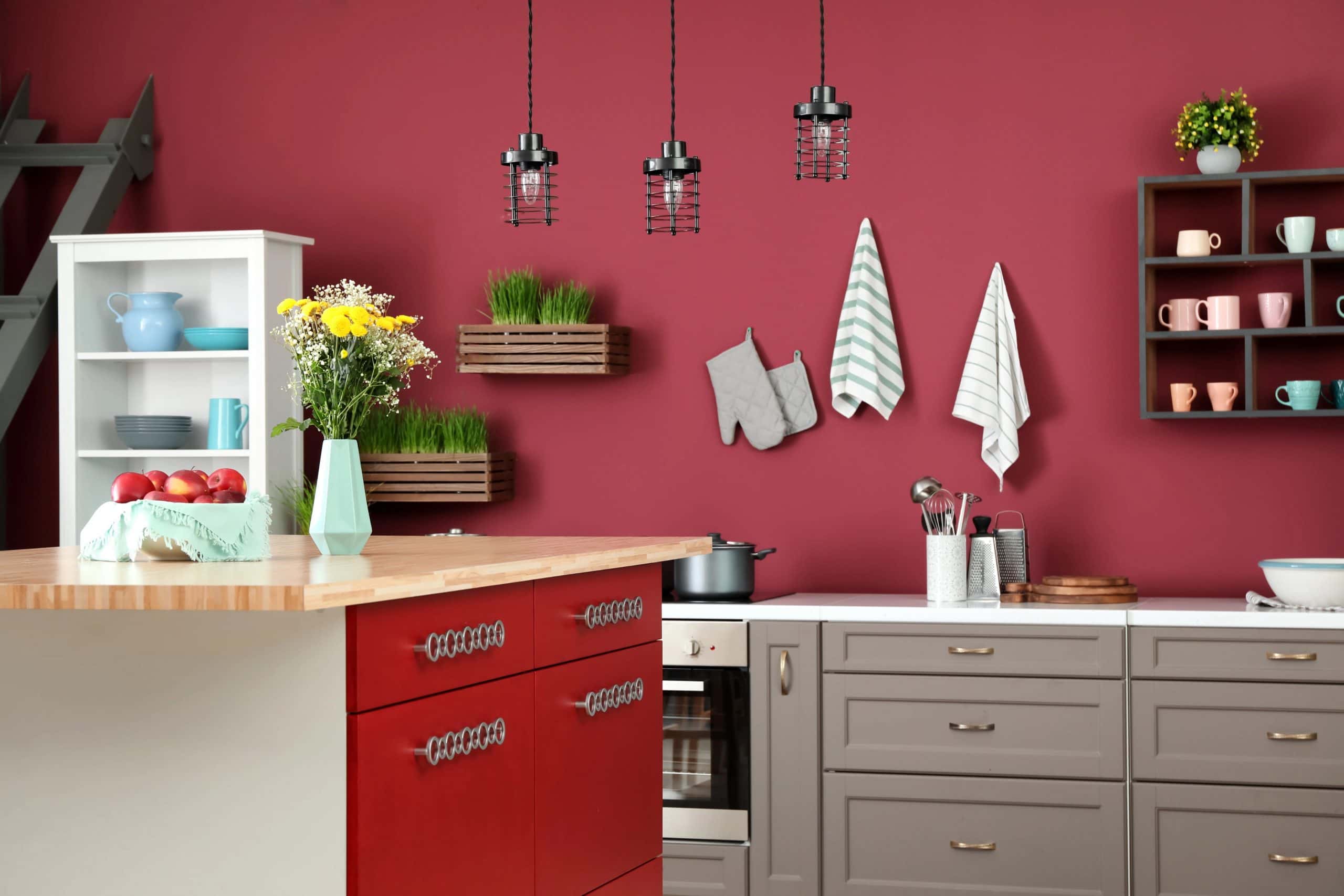 Modular kitchen colour combination in pink and red for a cozy, cheerful atmosphere