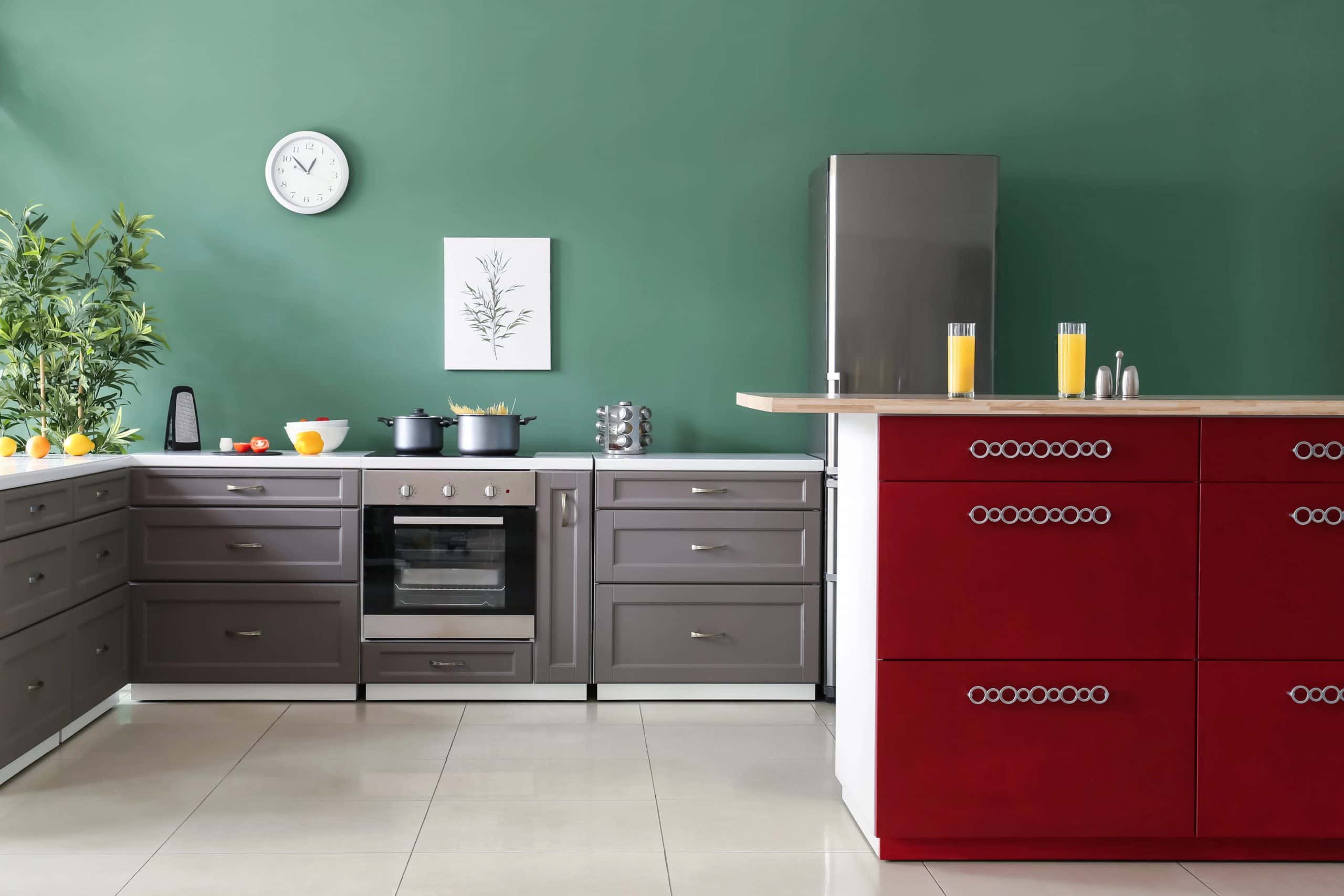 Grey modular kitchen colour combination with red cabinets and green backsplash