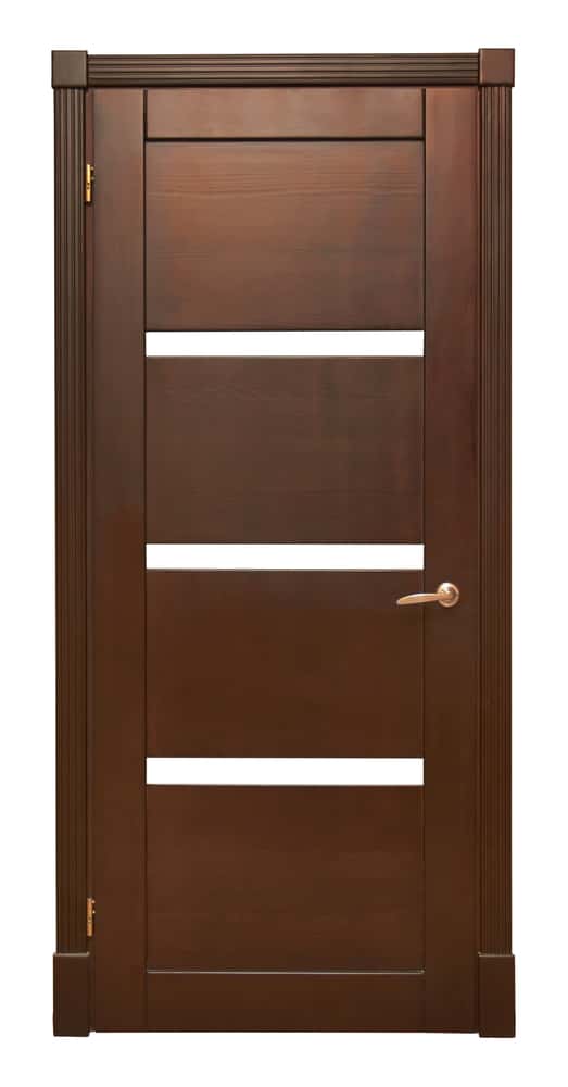 rosewood door is embellished with cornice