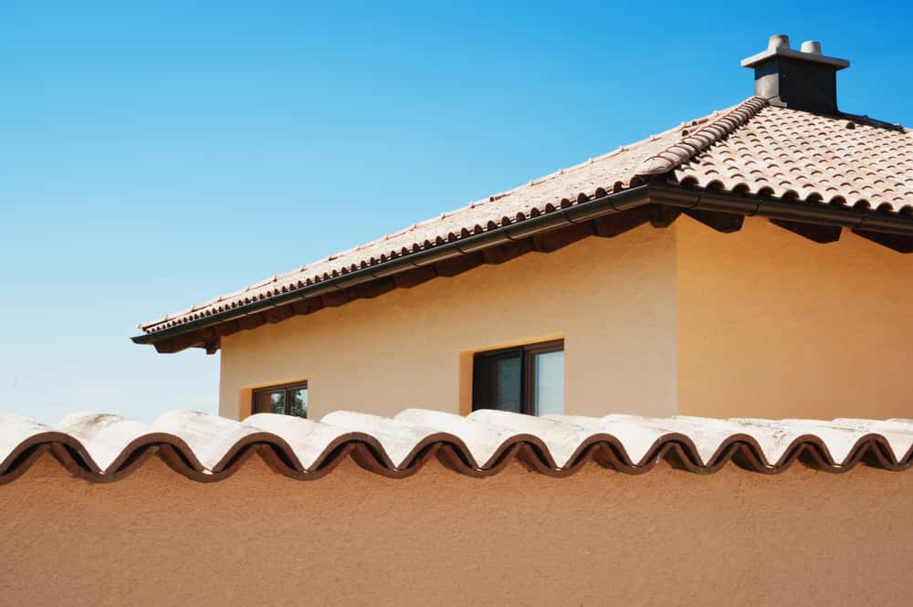 Solid Boundary Wall Design with cement base and tiled wave structure