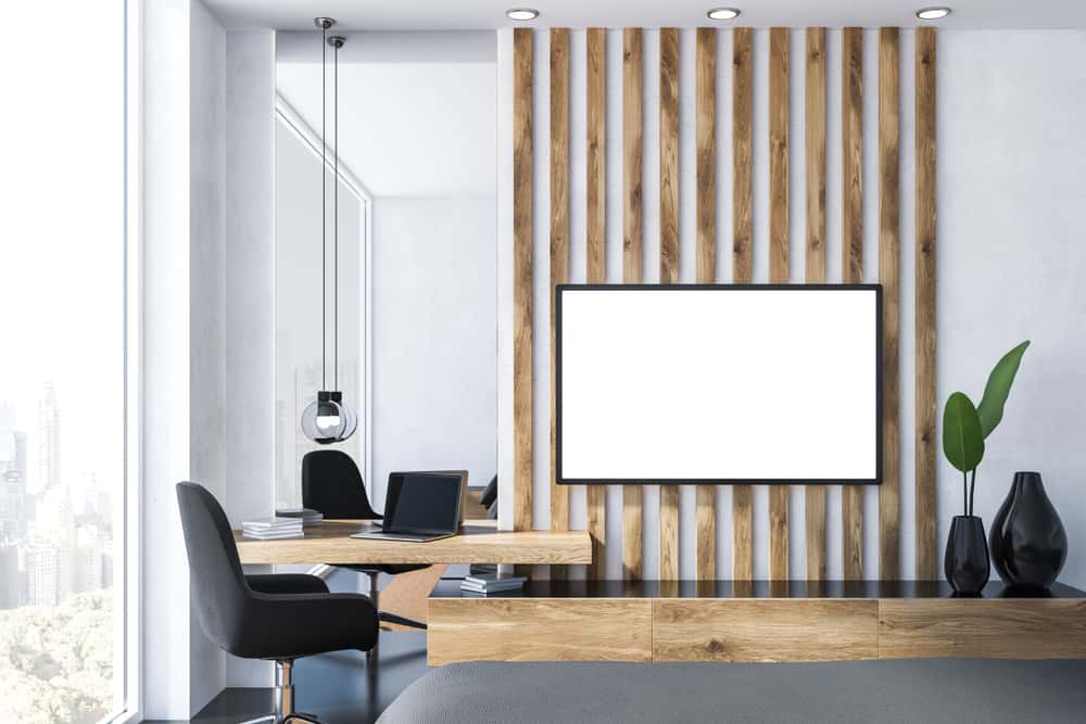 Modern hide TV wires panel with slatted wood wall and stylish decor