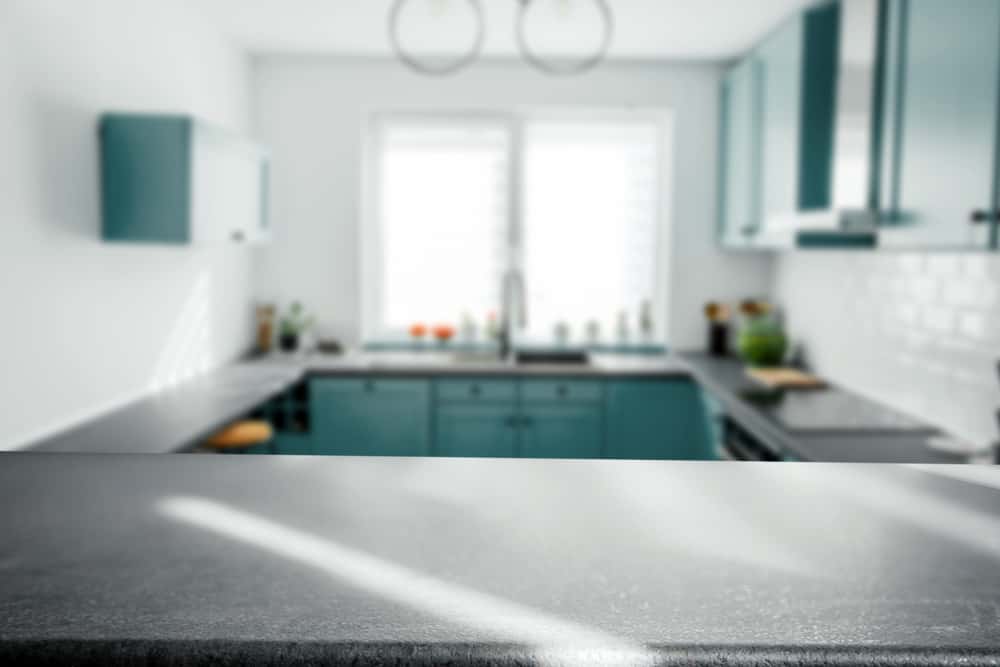 Parallel kitchens designs with sleek counters and teal cabinets