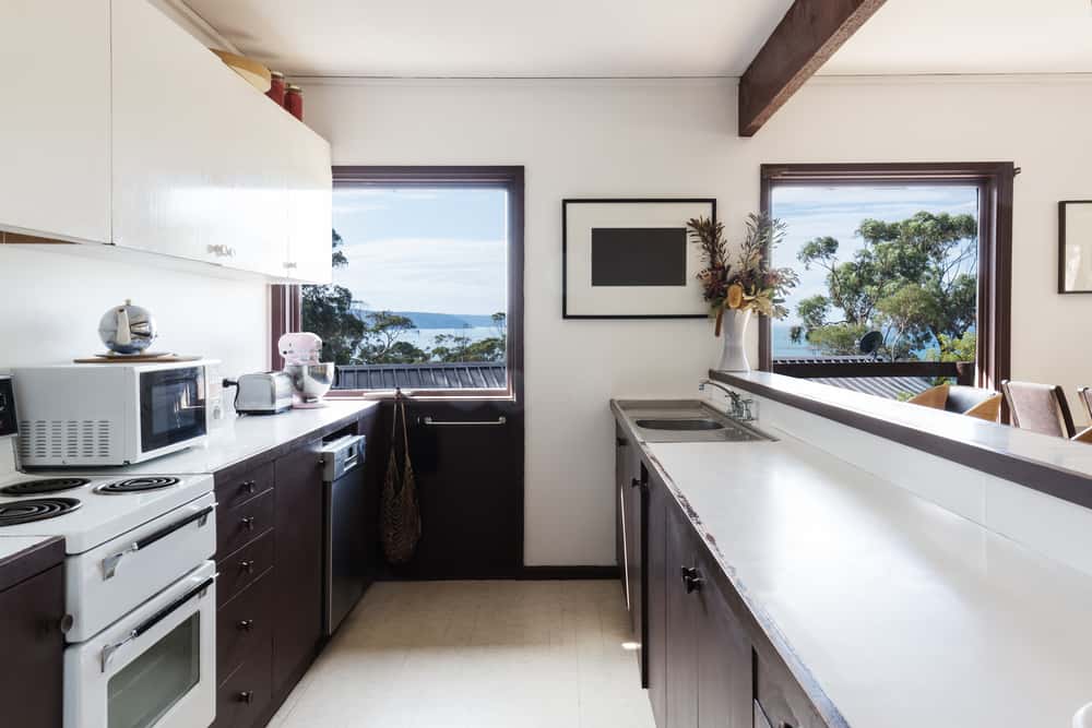 Best Parallel Kitchens Designs with window view and white countertop layout