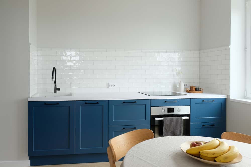 Small space Parallel Kitchens Designs with fresh blue and white theme