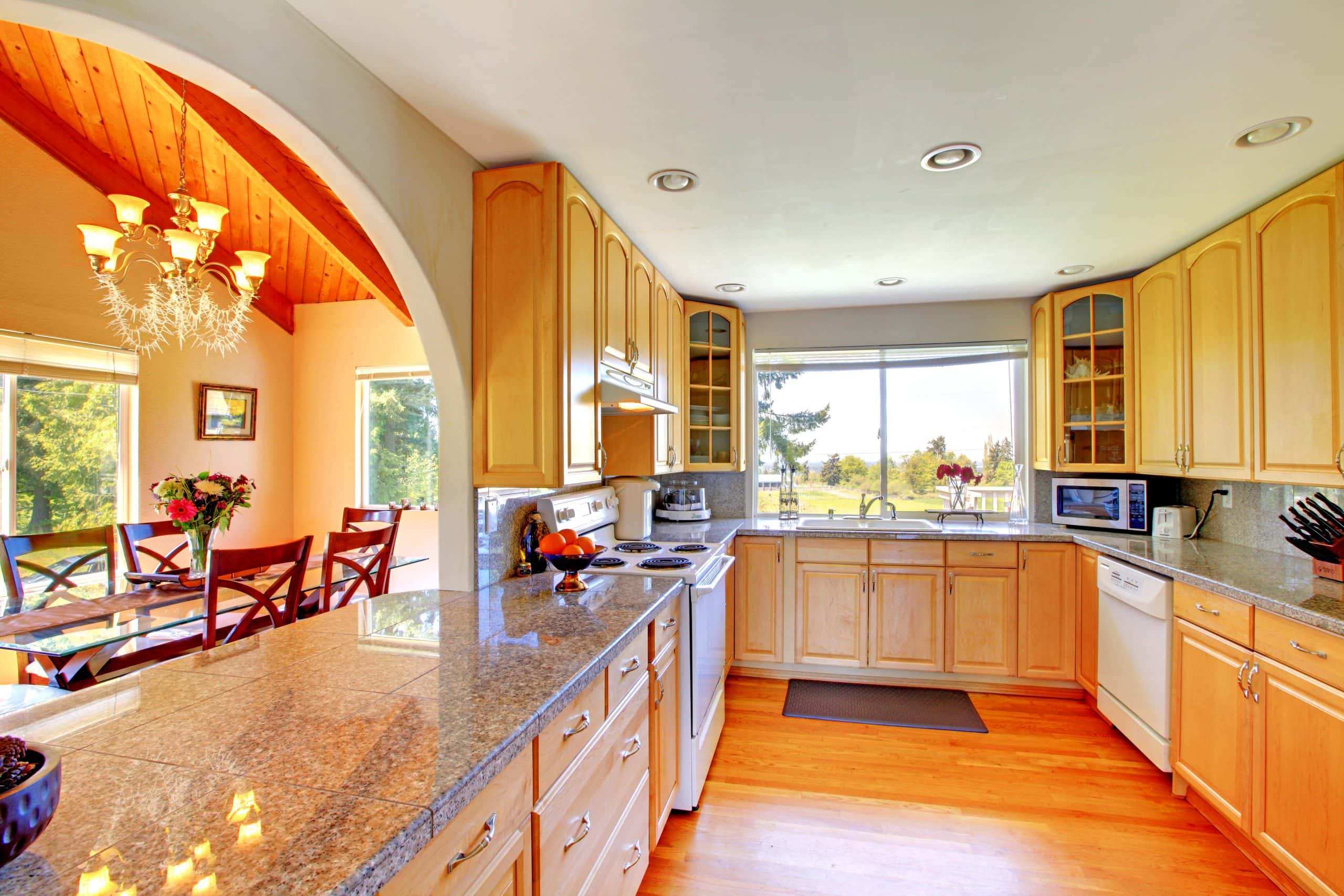 Classic kitchen color ideas with light wood cabinets and granite counters