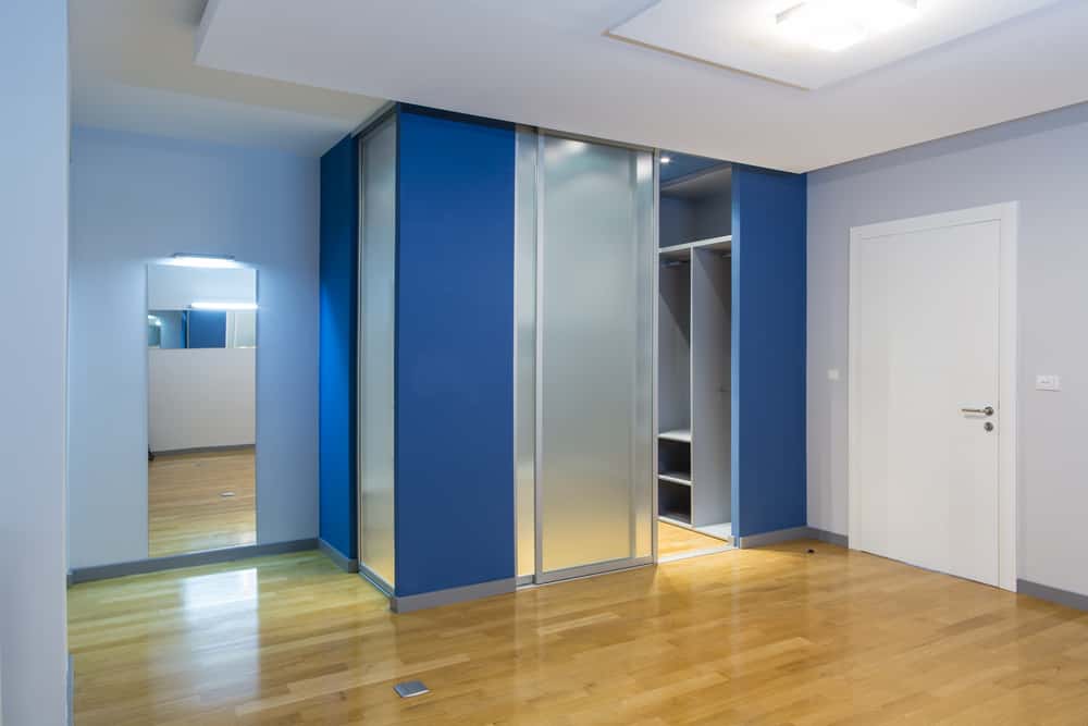 phone booth style glass wardrobe