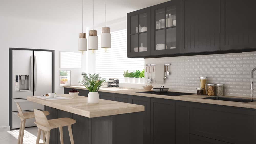Modern kitchen island designs with wood countertop and stools 