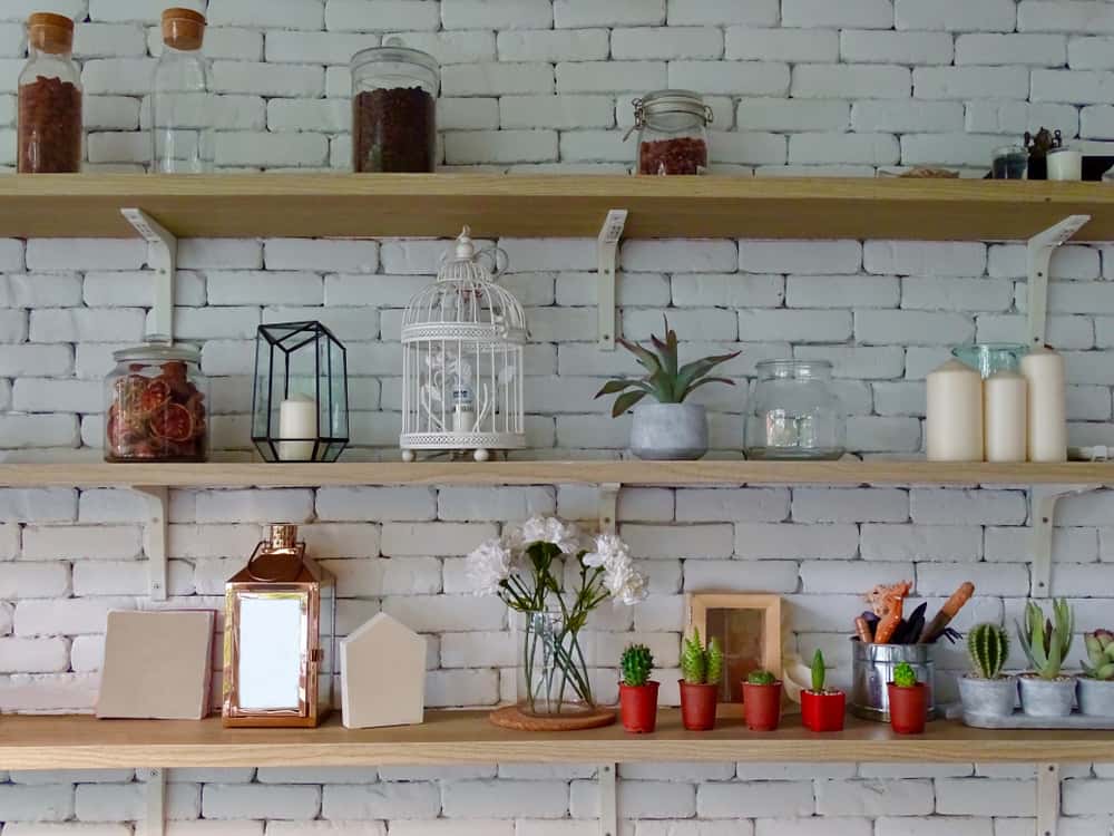 open shelves in brick walls