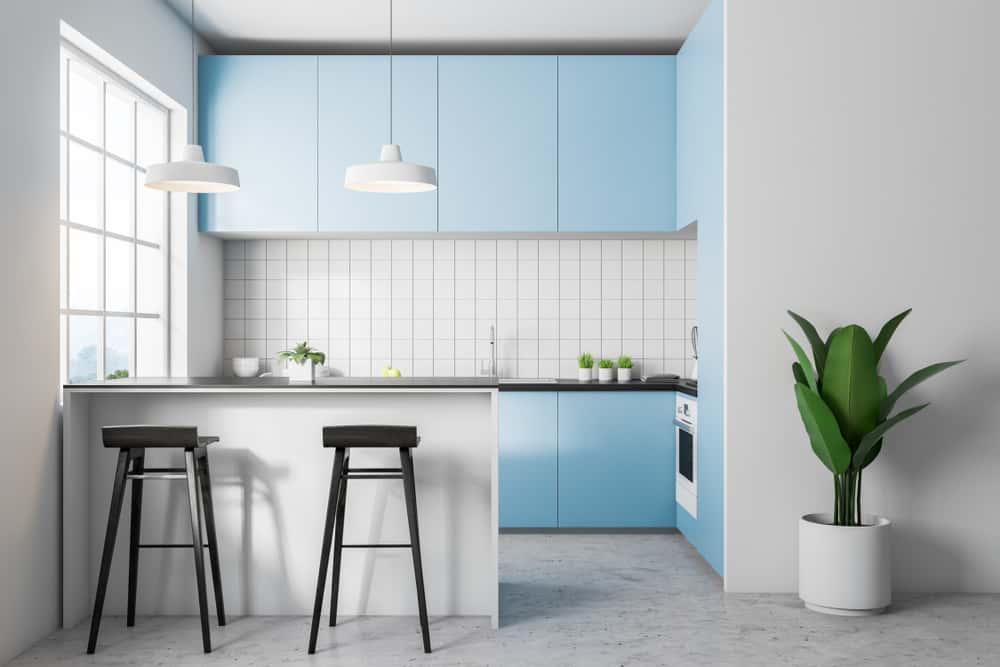 Minimal kitchen laminate designs with pastel blue cabinets and sleek tiled walls
