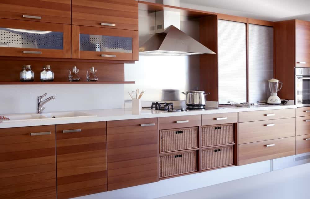 Wooden kitchen designs with modern cabinets and sleek countertop setup 