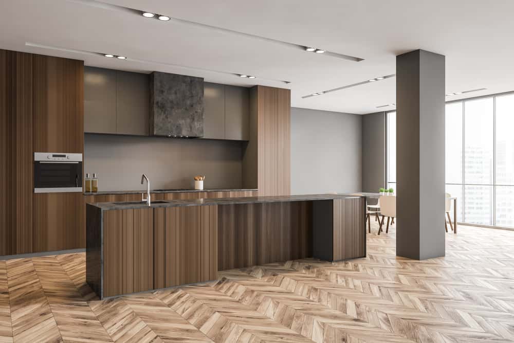 Modern wooden kitchen designs with sleek cabinets and island setup 