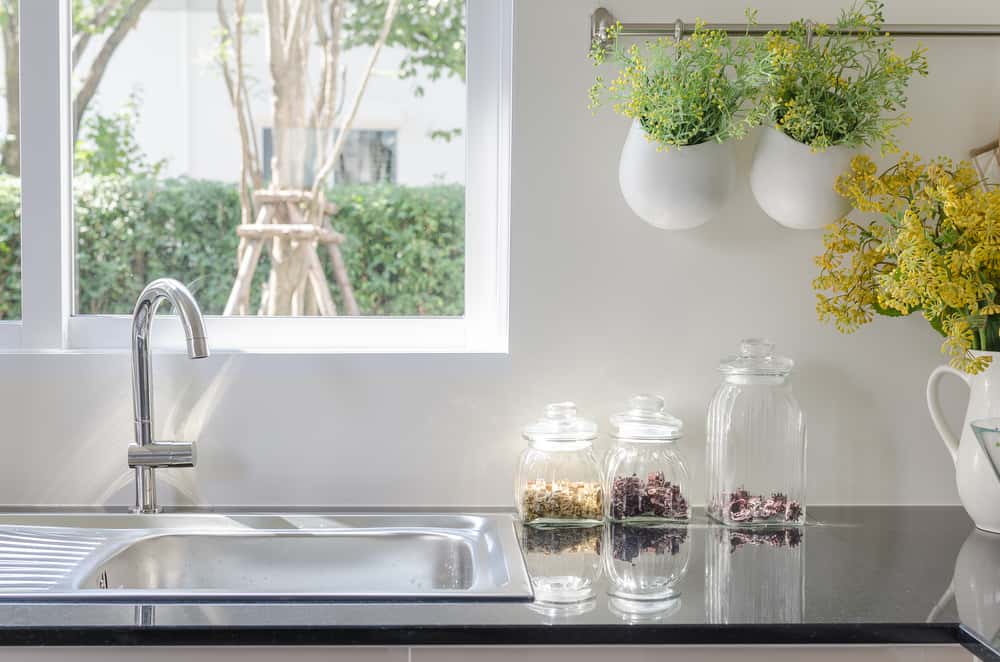 Simple Practical Kitchen Designs with natural light and hanging plants 