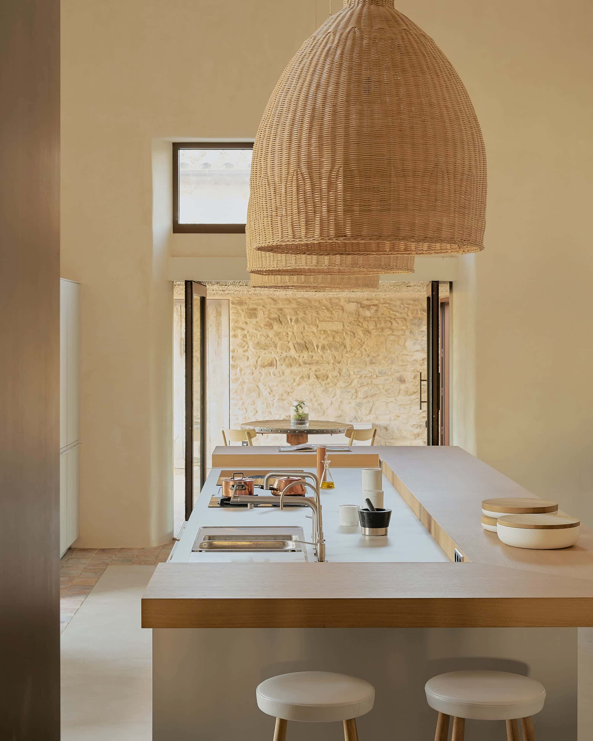 Warm industrial kitchen with wooden island open layout and natural lighting accents