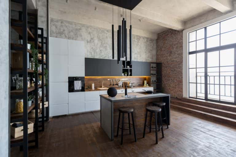 Modern industrial kitchen with brick wall and open loft inspired layout design