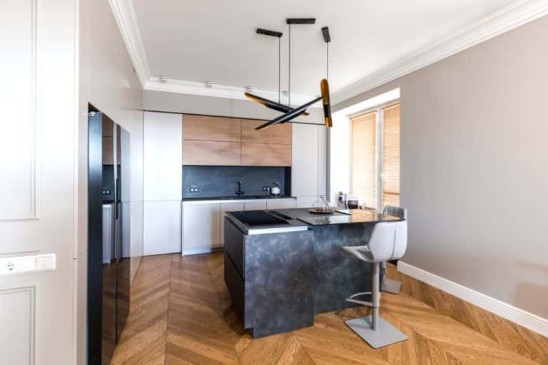 Modern handleless modular kitchen with sleek island and minimalist layout 