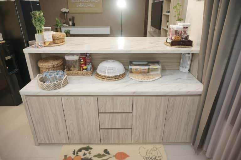 White handleless modular kitchen cabinet with smart food storage setup 