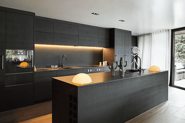 Modern contemporary kitchen design featuring island and built in lighting