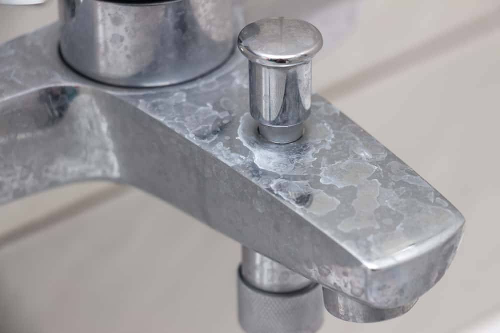 how to clean hard water scrum from tap