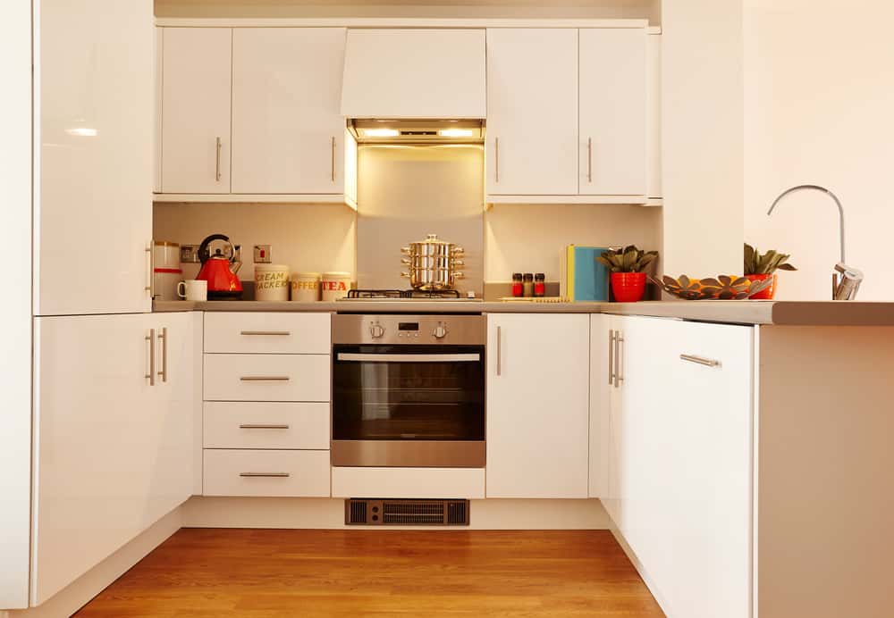 Contemporary modular kitchen designs using modern storage and corner sink