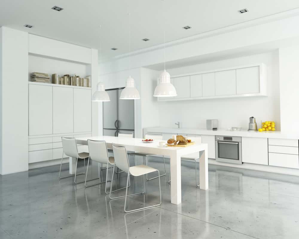 Modular kitchen designs with white cabinets and dining space