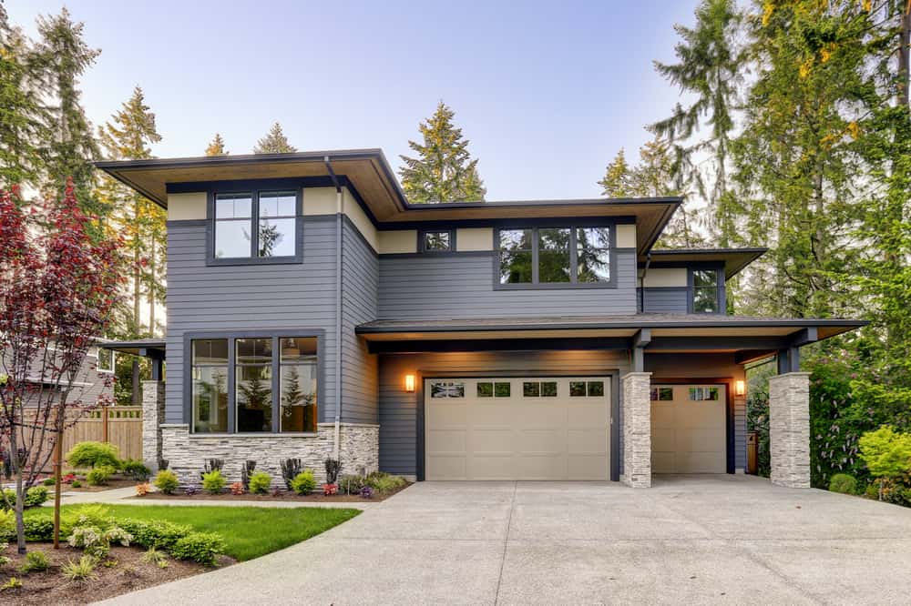 Modern front elevation colour combinations with grey walls and beige garage door accents
