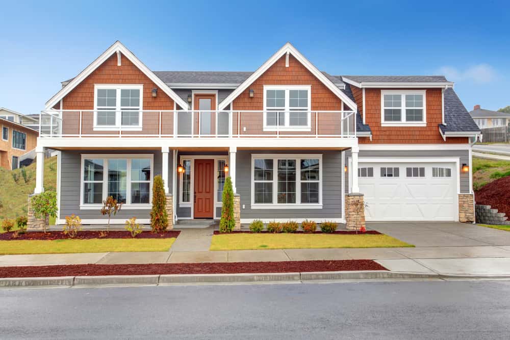 Stylish front elevation colour combinations with grey siding and burnt orange wall panels