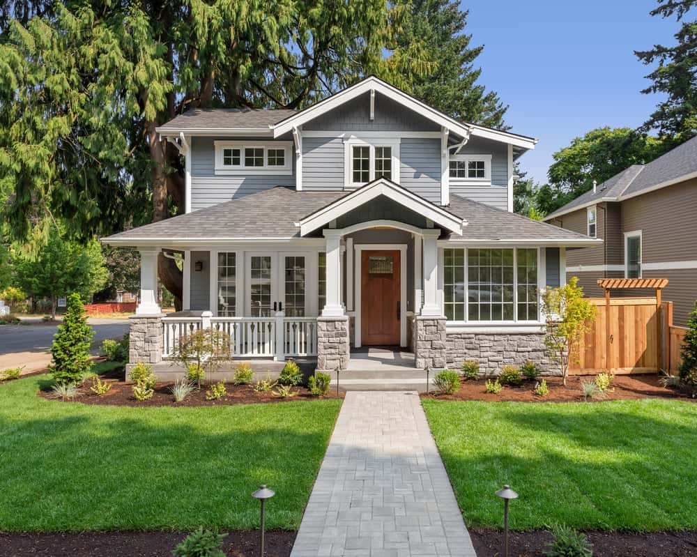 Timeless front elevation colour combinations with grey cladding, white trim, and natural accents