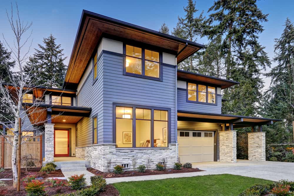 Elegant front elevation colour combinations with navy blue siding and stone wall cladding