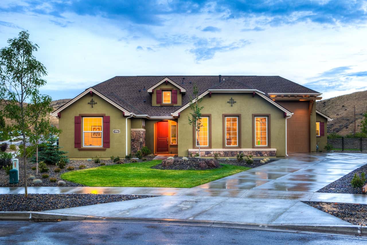 Elegant front elevation colour combinations in olive green, brown and rustic stone details