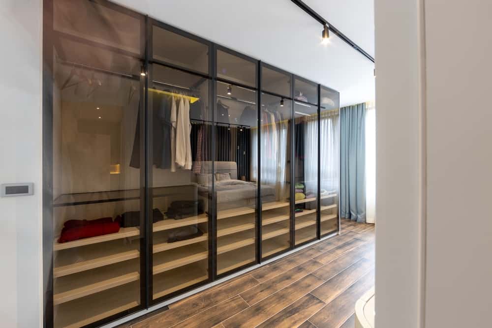 Glass wardrobe handle with sleek sliding design for modern bedroom