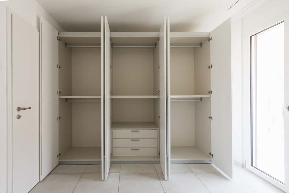 Modern Wardrobe Dimensions design with triple compartments and drawers