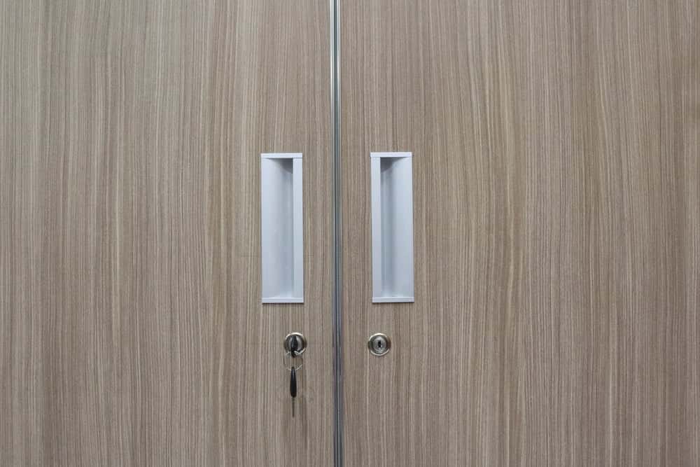 Sleek wardrobe handle design with white recessed pull style