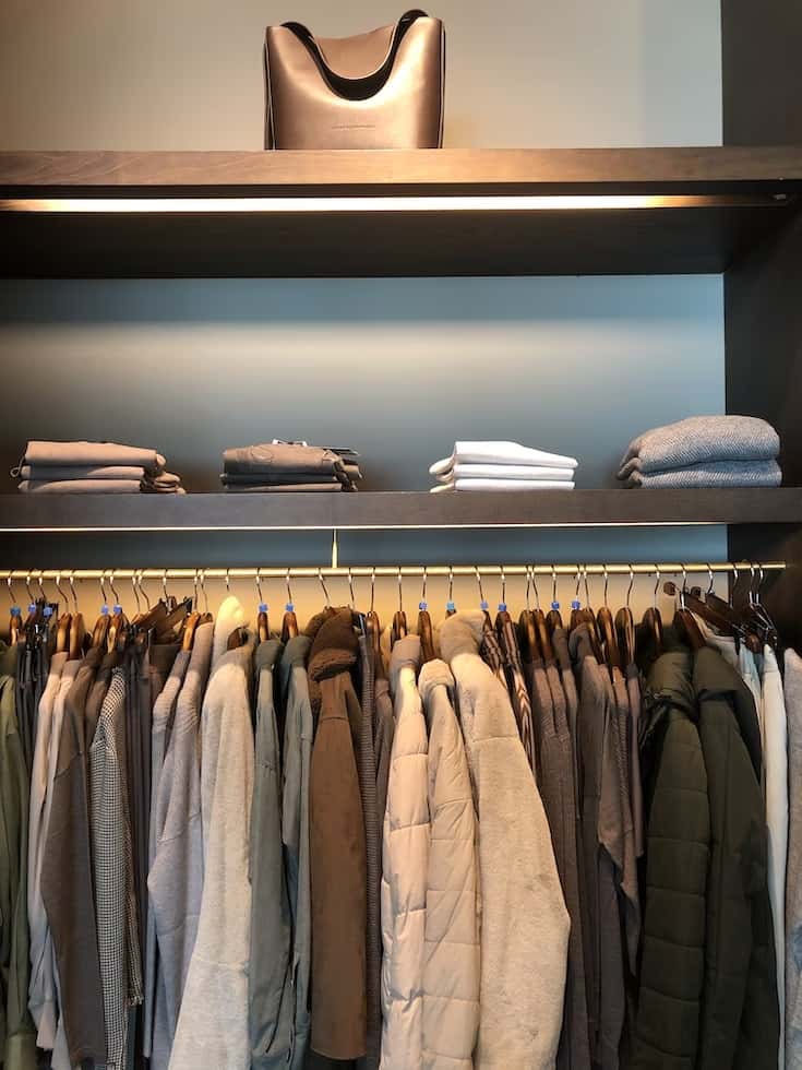 Modern Wardrobe Dimensions shelf with hanging winter clothing