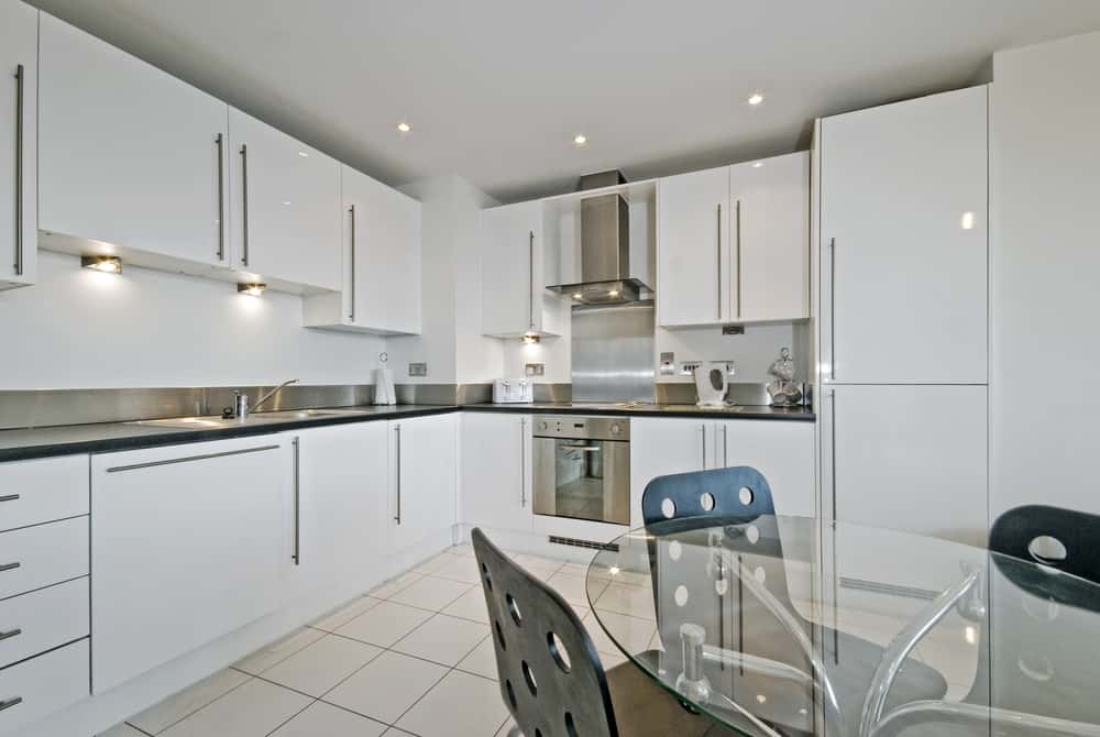 Modern kitchen with duco vs pu paint finish on sleek white cabinet shutters