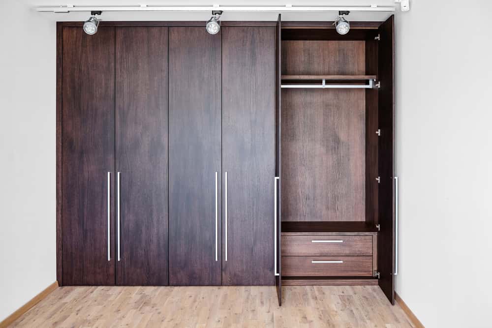 Modern wardrobe handle design on sleek full-height cabinet doors